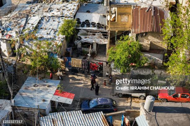 This picture taken on April 14, 2021 shows an elevated view of shacks where multiple marginalised families reside in the Ghoraba cemetery, named...