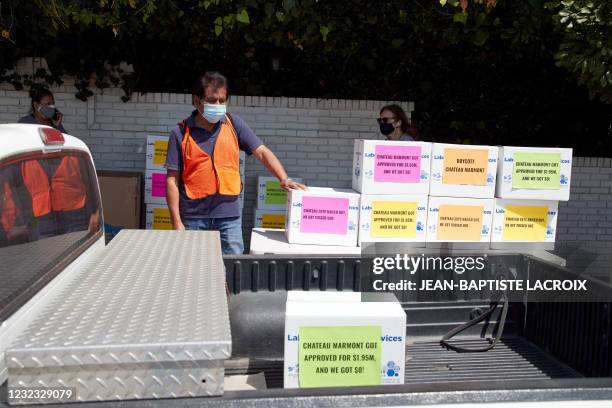 Boxes of food are distributed during a food distribution and protest in front of Chateau Marmont in Los Angeles, California, on April 15 as the...