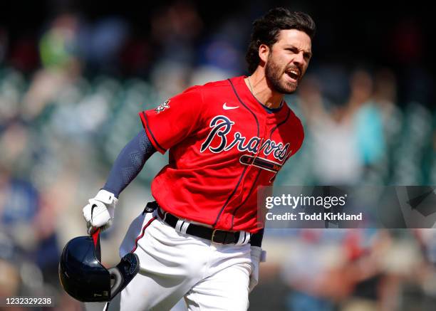 Dansby Swanson of the Atlanta Braves reacts after hitting the walk off, game winning single in the ninth inning of an MLB game against the Miami...