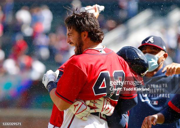 Dansby Swanson of the Atlanta Braves reacts after his game winning single in the ninth inning of an MLB game against the Miami Marlins at Truist Park...