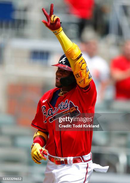 Ronald Acuna Jr. #13 of the Atlanta Braves reacts after hitting a two run home run in the fifth inning of an MLB game against the Miami Marlins at...