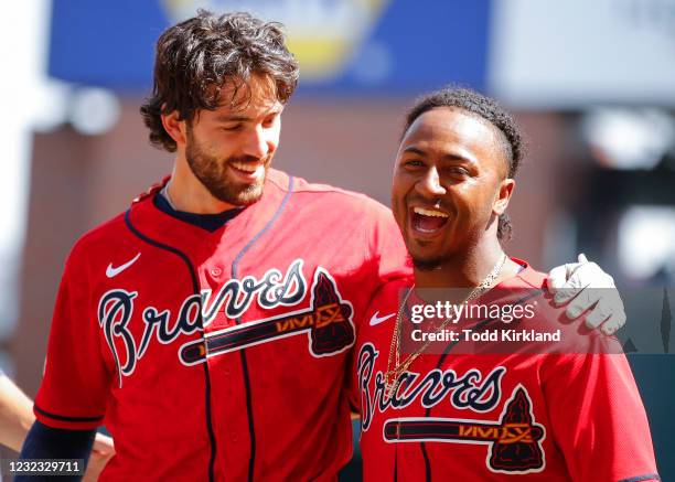 Dansby Swanson celebrates the victory with Ozzie Albies of the Atlanta Braves at the conclusion of an MLB game against the Miami Marlins at Truist...