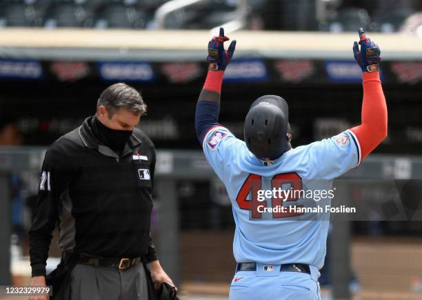 Miguel Sano of the Minnesota Twins celebrates after hitting a solo home run against the Boston Red Sox during the sixth inning of the game at Target...