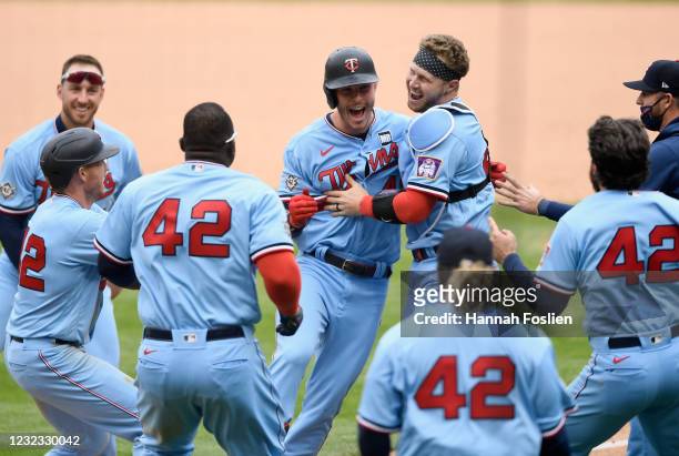 Max Kepler of the Minnesota Twins celebrates a walk-off single against the Boston Red Sox after the game at Target Field on April 15, 2021 in...