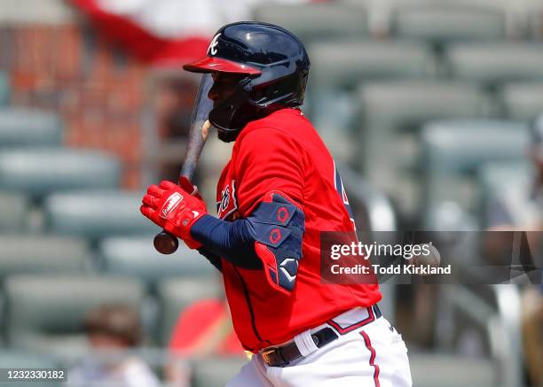 Guillermo Heredia of the Atlanta Braves is hit by a pitch in the sixth inning of an MLB game against the Miami Marlins at Truist Park on April 15,...