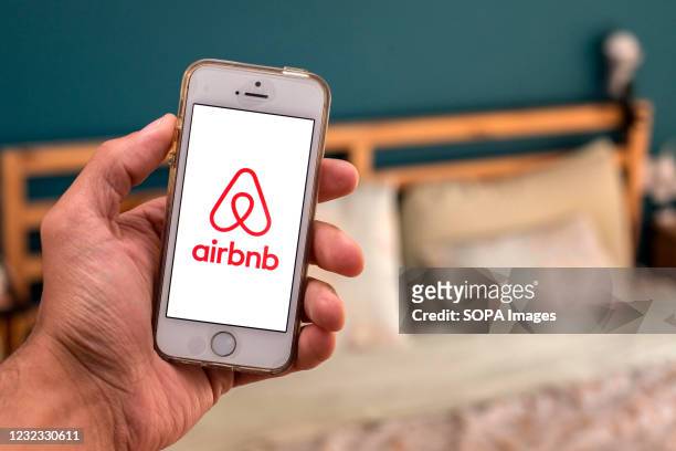 In this photo illustration, the Airbnb app seen displayed on a smartphone screen.