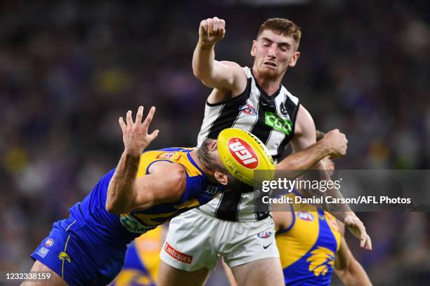Mark Keane of the Magpies spoils in a marking contest during the 2021 AFL Round 05 match between the West Coast Eagles and the Collingwood Magpies at...