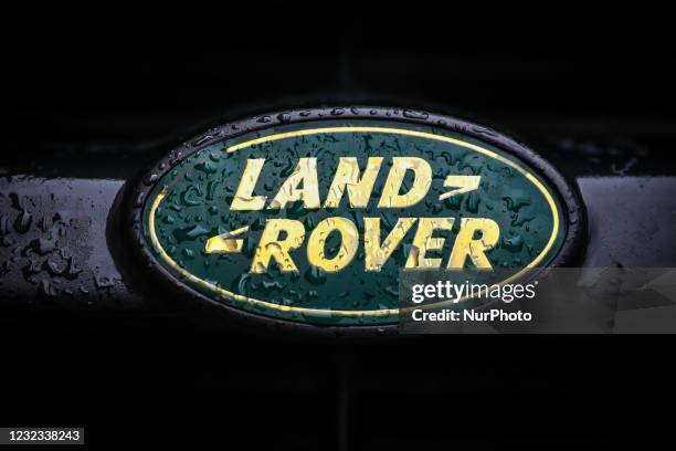 Land Rover car emblem is covered with raindrops. Krakow, Poland on April 16, 2021