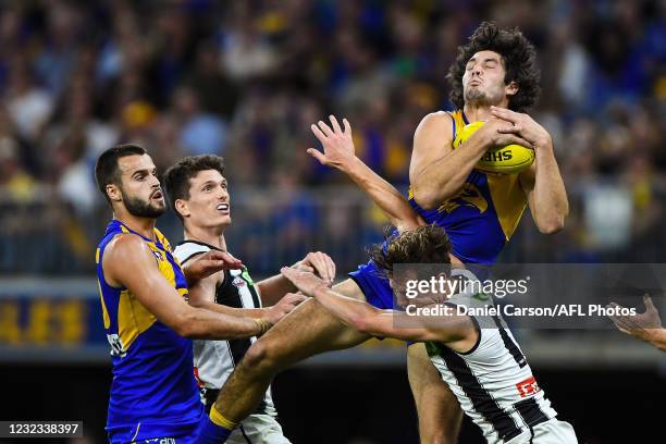 Tom Barrass of the Eagles marks the ball during the 2021 AFL Round 05 match between the West Coast Eagles and the Collingwood Magpies at Optus...