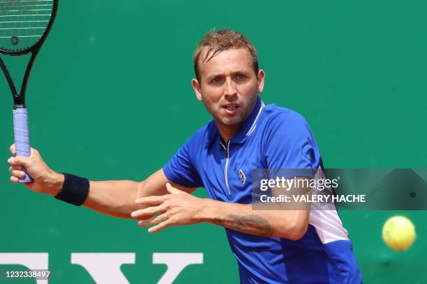 Britain's Daniel Evans looks at the ball during his quarter final singles match against Belgium's David Goffin on day seven of the Monte-Carlo ATP...