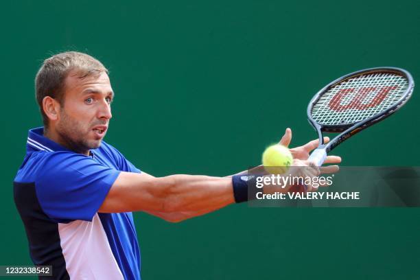 Britain's Daniel Evans plays a return during his quarter final singles match against Belgium's David Goffin on day seven of the Monte-Carlo ATP...