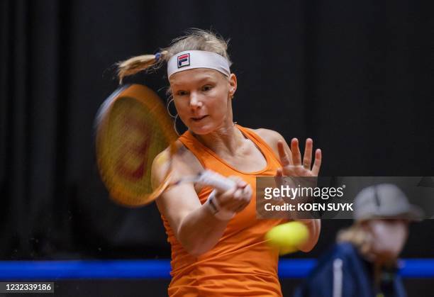 Dutch tennis player Kiki Bertens returns the ball against China's Xinyu Wang in the Billie Jean King Cup tennis Play-off in Den Bosch on April 16,...