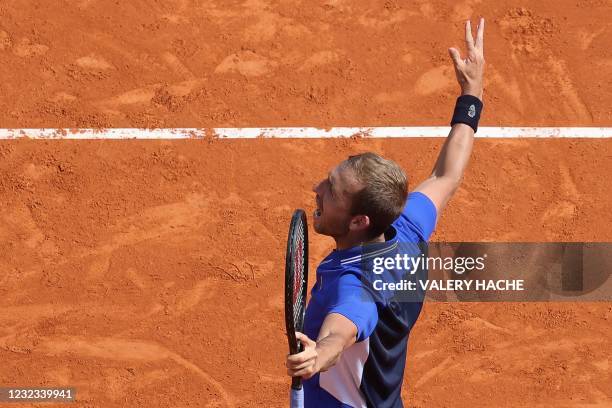 Britain's Daniel Evans celebrates after winning his quarter final singles match against Belgium's David Goffin on day seven of the Monte-Carlo ATP...