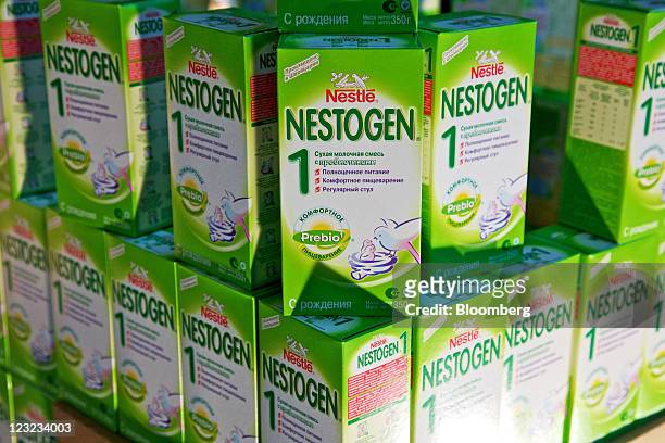 Packets of newly-manufactured "Nestogen" baby food supplement sit on display at Nestle's production unit for probiotic infant formulas in...
