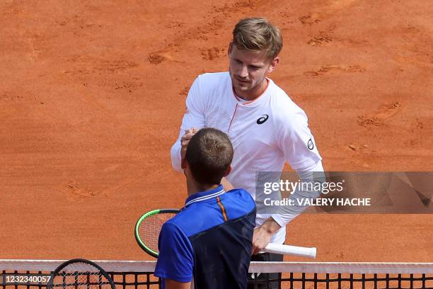 Britain's Daniel Evans shakes hands with Belgium's David Goffin after winning in their quarter final singles match on day seven of the Monte-Carlo...