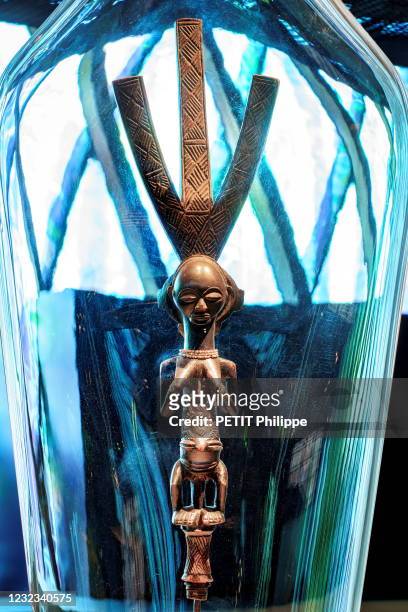 Luba arrow holder in wood, plant fibers and pearl necklace is photographed for Paris Match in the Museum Quai Branly-Jacques Chirac at a new...