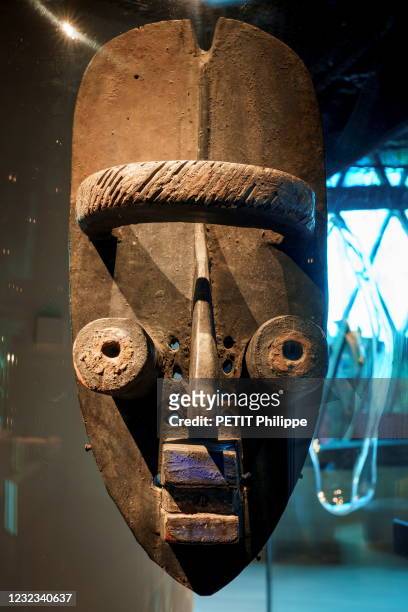 Anthropomorphic grebo mask is photographed for Paris Match in the Museum Quai Branly-Jacques Chirac at a new permanent exhibition space imagined by...