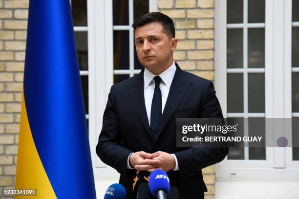 Ukrainian President Volodymyr Zelensky looks on during a press conference at the Ukraine's embassy in Paris on April 16, 2021 after a working lunch...