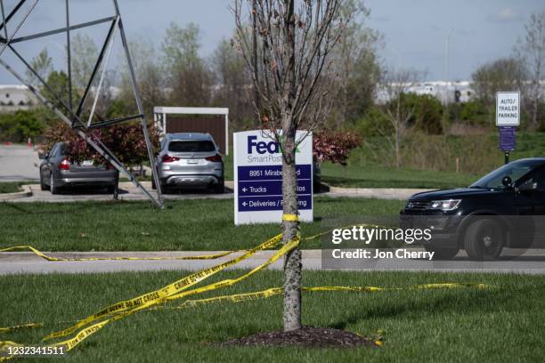 Tree wrapped in caution tape is seen near the parking lot of a FedEx SmartPost on April 16, 2021 in Indianapolis, Indiana. The area is the scene of a...