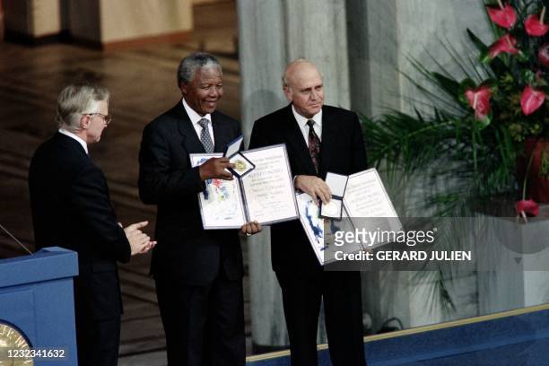 Nelson Mandela, President of South African African National Congress and South African President Frederik de Klerk display on December 09, 1993 in...