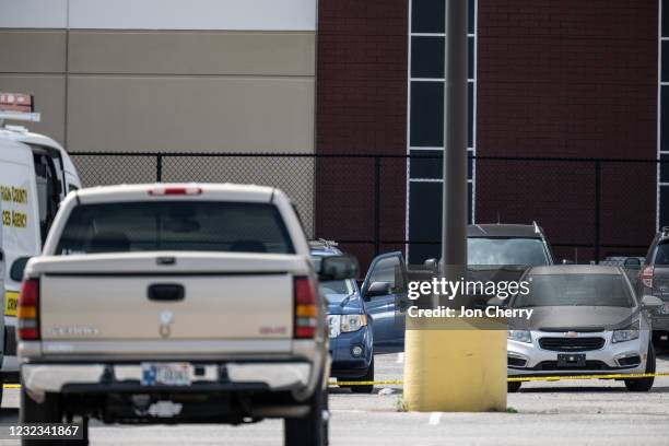 Vacant vehicles and caution tape are seen in the parking lot of a FedEx SmartPost on April 16, 2021 in Indianapolis, Indiana. The area is the scene...