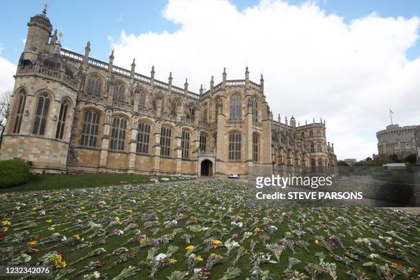 Flowers left as tributes are pictured outside St George's Chapel, at Windsor Castle in Windsor, west of London, on April 16 following the April 9...