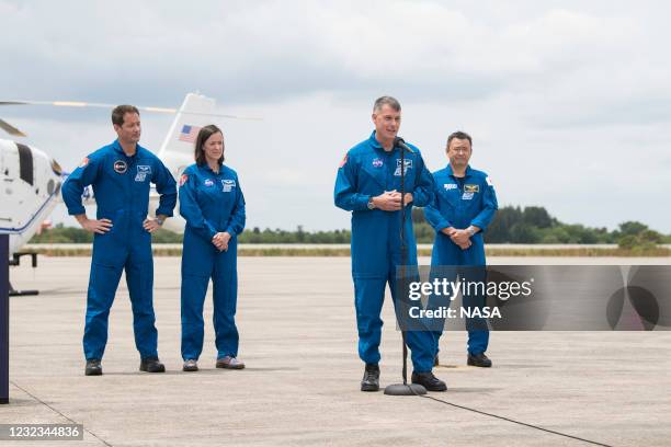 Astronaut Shane Kimbrough answers a question while crew mates ESA astronaut Thomas Pesquet, left, NASA astronaut Megan McArthur, center, and Japan...