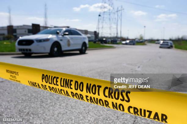 Police caution tape blocks the entrance to the site of a mass shooting at a FedEx facility in Indianapolis, Indiana on Friday, April 16, 2021. - A...