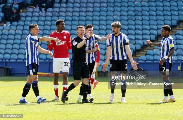 Sheffield Wednesday players remonstrate with referee Tony Harrington after Bristol City's Henri Lansbury tipped a first half effort over the bar with...