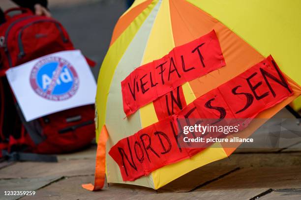 April 2021, Hessen, Volkmarsen: "Diversity in North Hesse" is written on a colorful umbrella at a demonstration against the federal congress of the...