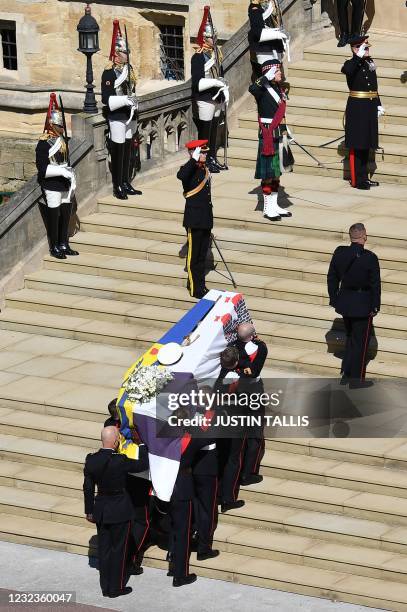 Pallbearers of the Royal Marines carry the coffin into St George's Chapel to mark the start of the funeral service of Britain's Prince Philip, Duke...