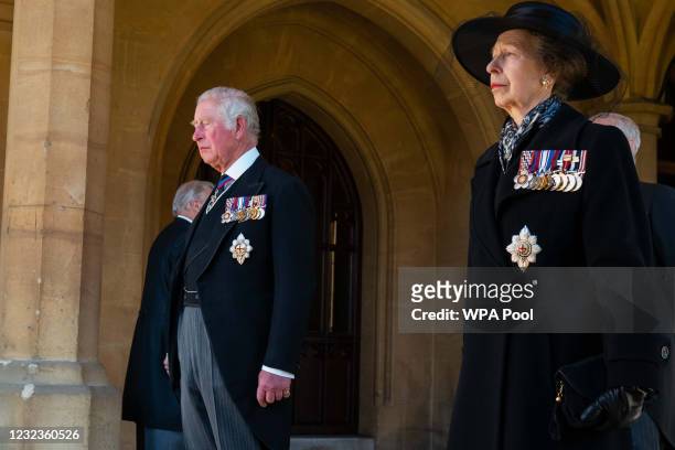 Princess Anne, Princess Royal, Prince Charles, Prince of Wales follow the Land Rover Defender hearse carrying the Duke of Edinburgh's coffin during...