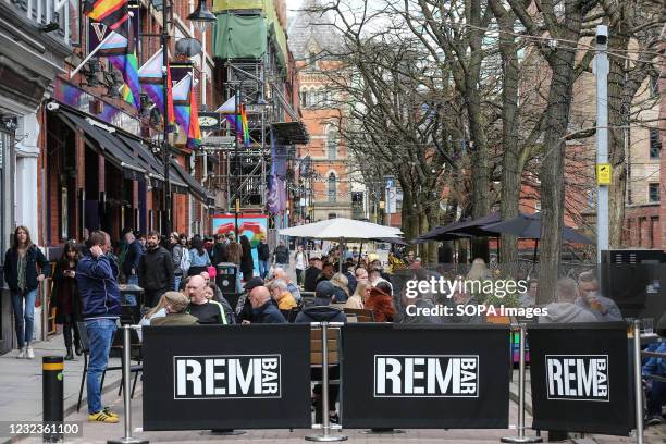 People gather in the bars and pubs on the Canal Street in Manchesters Gay Village. Pubs and restaurants with outdoor space have been allowed to...