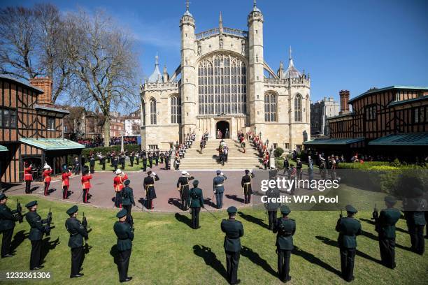 Prince Philip, Duke of Edinburgh’s coffin, covered with His Royal Highness’s Personal Standard arrives at St George’s Chapel carried by a bearer...