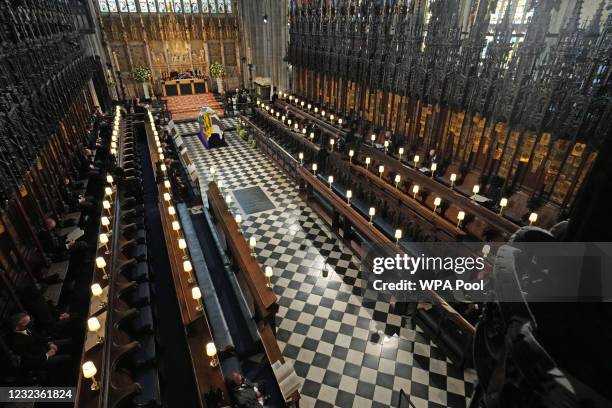 The Duke of Edinburgh’s coffin, covered with His Royal Highness’s Personal Standard lies in St George’s Chapel during the funeral of Prince Philip,...