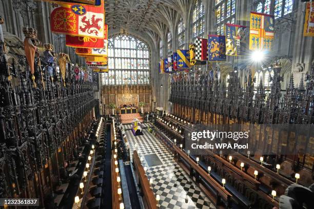 The Duke of Edinburgh’s coffin, covered with His Royal Highness’s Personal Standard lies in St George’s Chapel during the funeral of Prince Philip,...