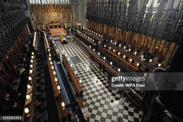 The Duke of Edinburgh’s coffin, covered with His Royal Highness’s Personal Standard lies in St George’s Chapel during the funeral of Prince Philip,...