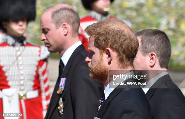Prince William, Duke of Cambridge; Prince Harry, Duke of Sussex and Peter Phillips walk behind Prince Philip, Duke of Edinburgh's coffin, carried by...