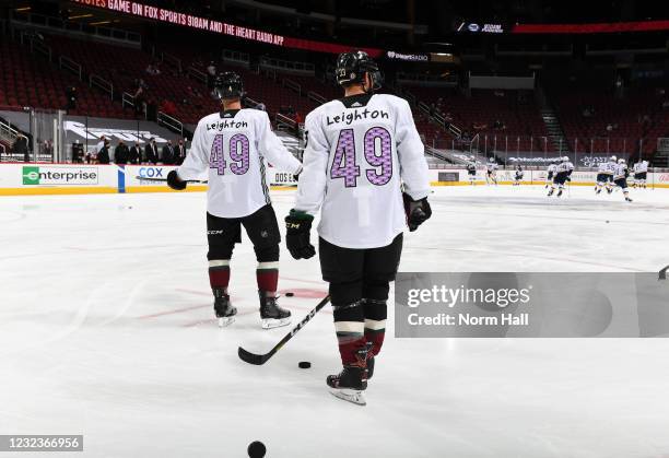 Niklas Hjalmarsson and Alex Goligoski of the Arizona Coyotes wear special warm-up jerseys honoring 9 year old Leighton Accardo prior to the NHL...