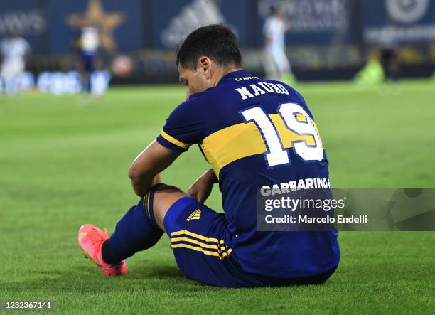 Mauro Zarate of Boca Juniors reacts after suffering an injury during a match between Boca Juniors and Atletico Tucuman as part of Copa de la Liga...