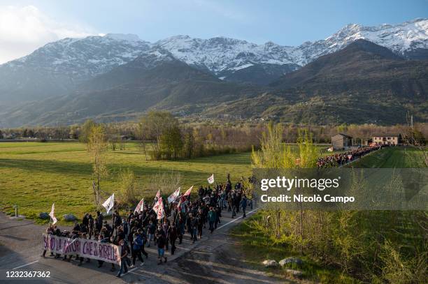 Demonstrators hold a banner reading 'We are nature that rebels' during a 'No TAV' demonstration against Lyon-Turin high speed rail link.