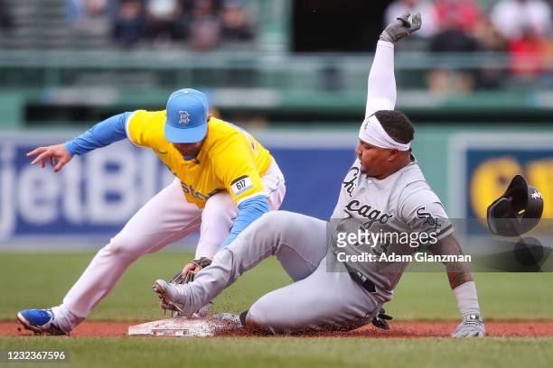 Yermin Mercedes of the Chicago White Sox is tagged out at second base by Christian Arroyo of the Boston Red Sox in the fifth inning of the MLB game...