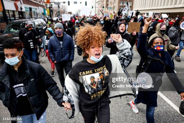 Xsuela Douglas yells as she marches near the Colorado State Capitol to protest the deaths of Daunte Wright and Adam Toledo on April 17, 2021 in...