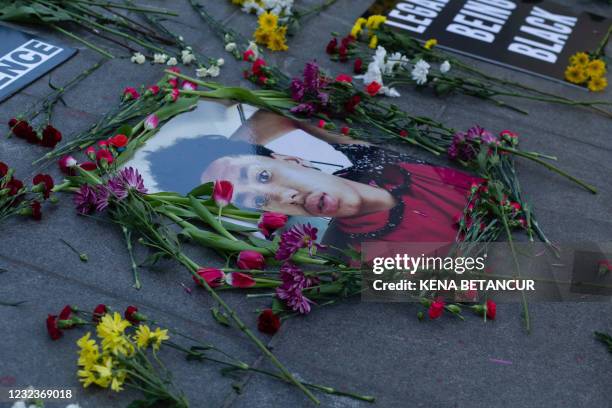 Flowers, candles and placards are seen at a makeshift memorial in honor of Daunte Wright, who was shot dead by a police officer in Minneapolis, in...