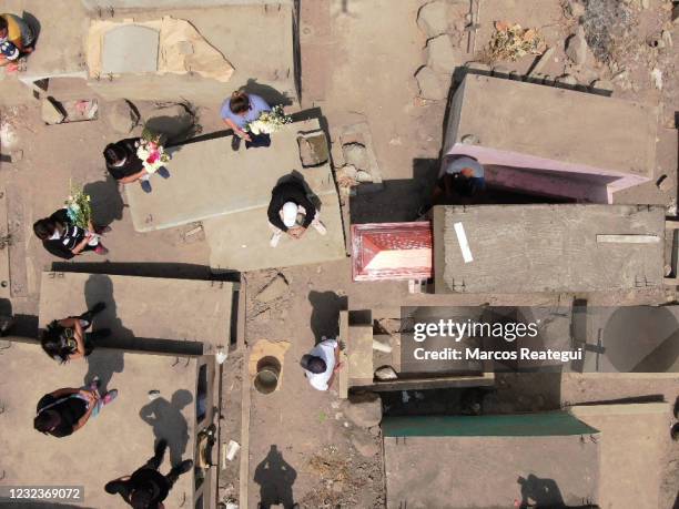 Aerial view during the burial of Jesús Sánchez Turín who died of COVID according to his relatives, at "Martires 19 de Julio" cemetery on April 17,...