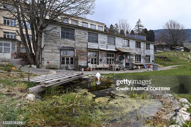 This photograph taken on April 18, 2021 shows a wooden house in a closed down factory housing a "self managed community" in Sainte-Croix,...