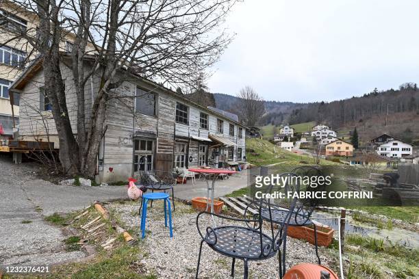 This photograph taken on April 18, 2021 shows a wooden house in a closed down factory housing a "self managed community" in Sainte-Croix,...