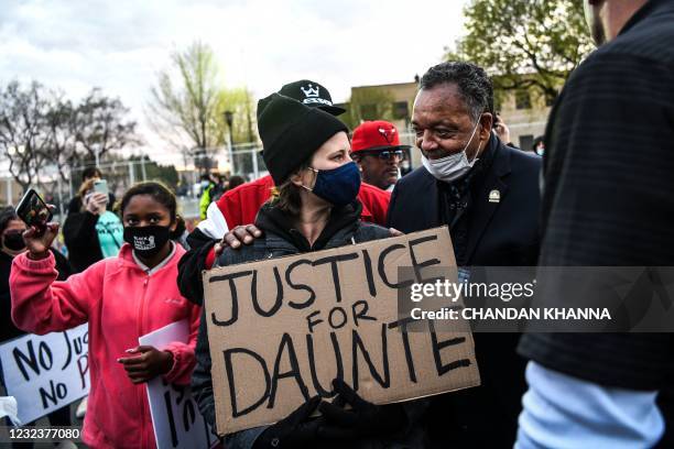 The Rev. Jesse Jackson meets with protestors at the Brooklyn Center Police Department in Brooklyn Centre, Minnesota on April 17, 2021. - Police...