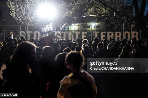 Demonstrators gather during the seventh night of protests over the shooting death of Daunte Wright by a police officer in Brooklyn Center, Minnesota...