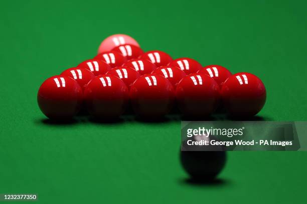 The red balls set up on the table before play during day 1 of the Betfred World Snooker Championships 2021 at The Crucible, Sheffield. Picture date:...
